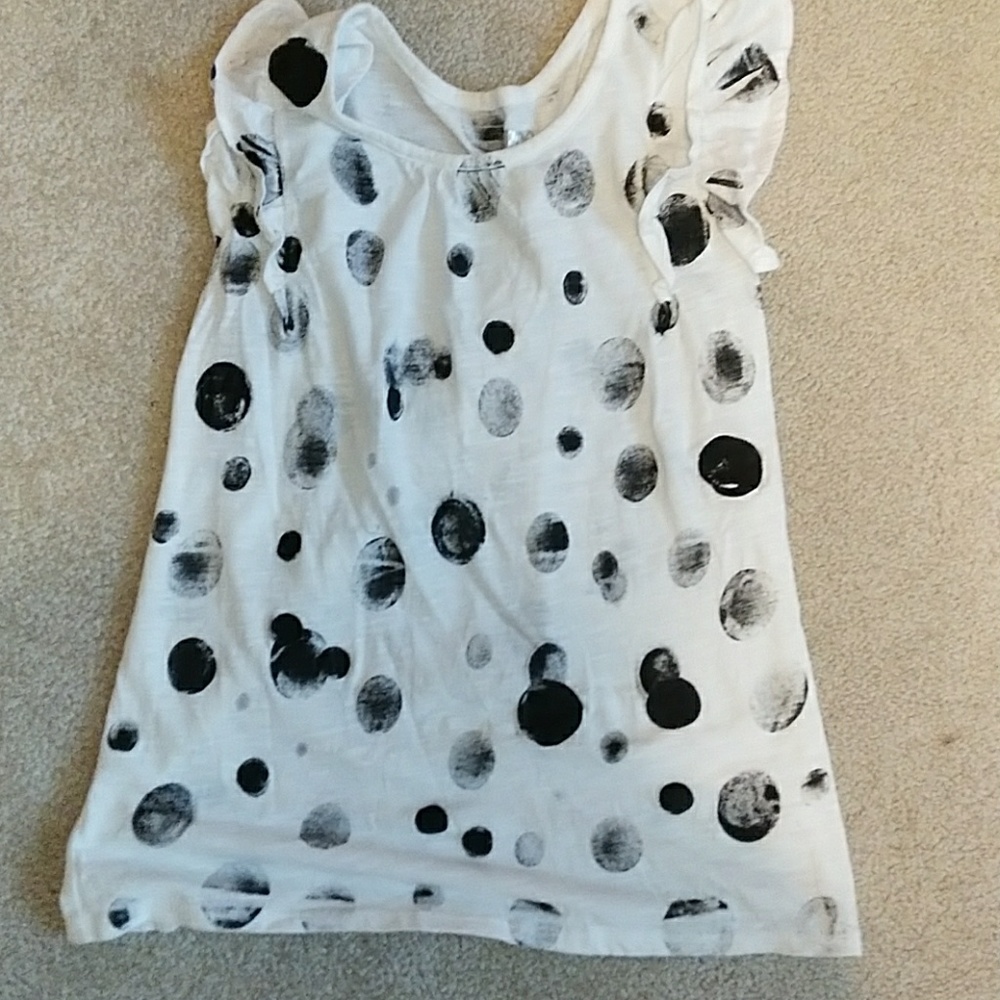A black polka dot shirt.